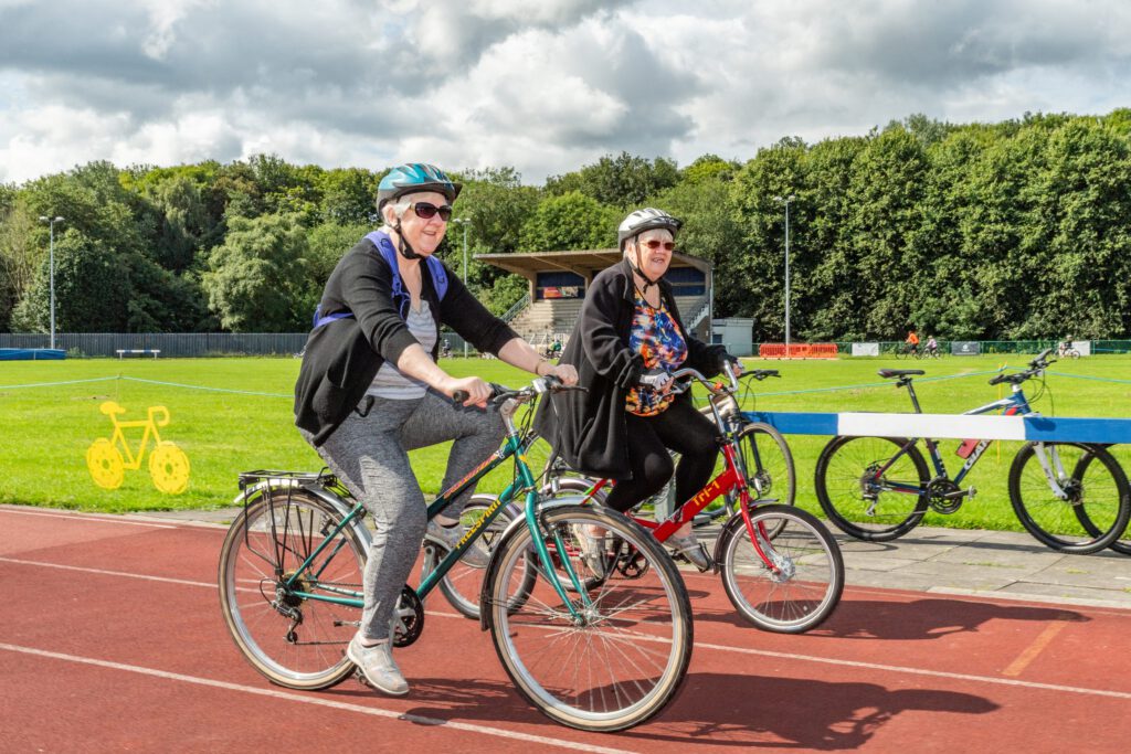an image of two people riding bikes