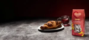a photo of a superlife infusions tea box and a croissant