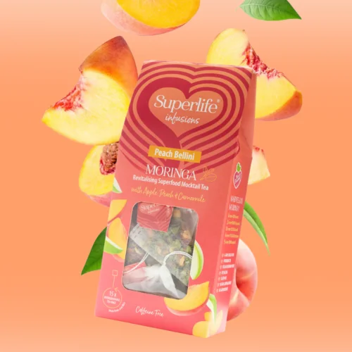 a tea box with peaches falling behind it
