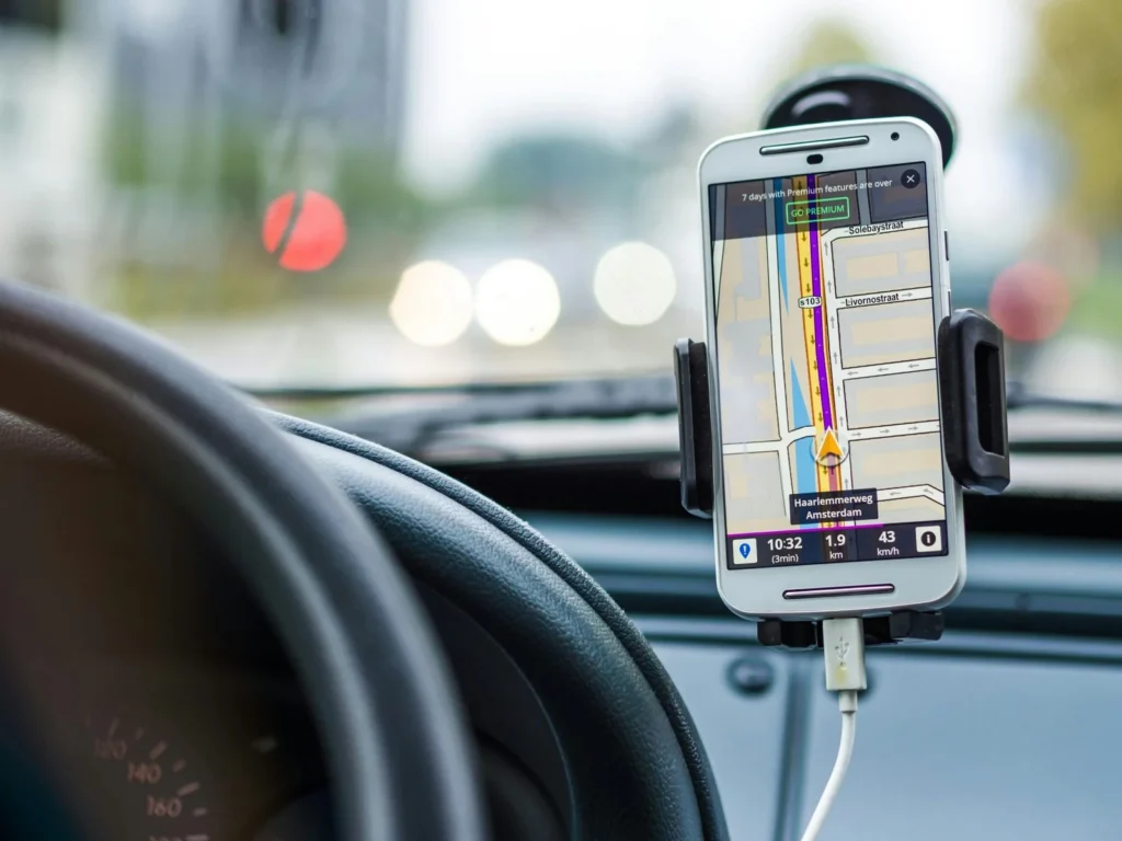 a photo of a map on a phone inside a car